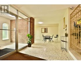 A living room with a glass door leading to a balcony.
