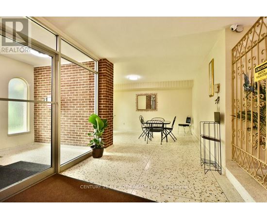 A living room with a glass door leading to a balcony.