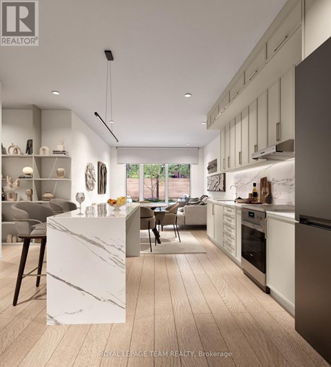 A modern kitchen with a marble island and stainless steel appliances.