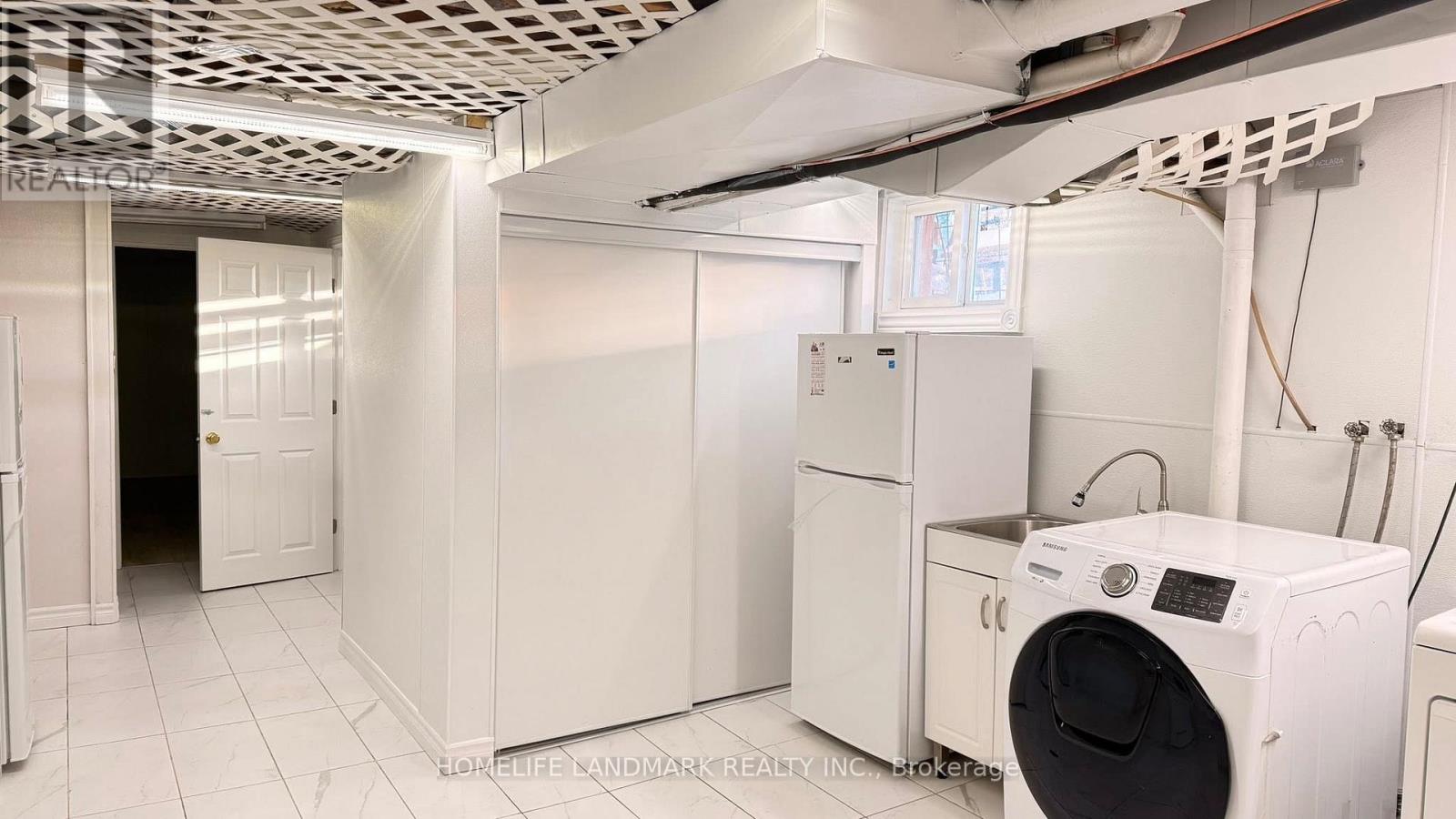 A laundry room with a washer and dryer.