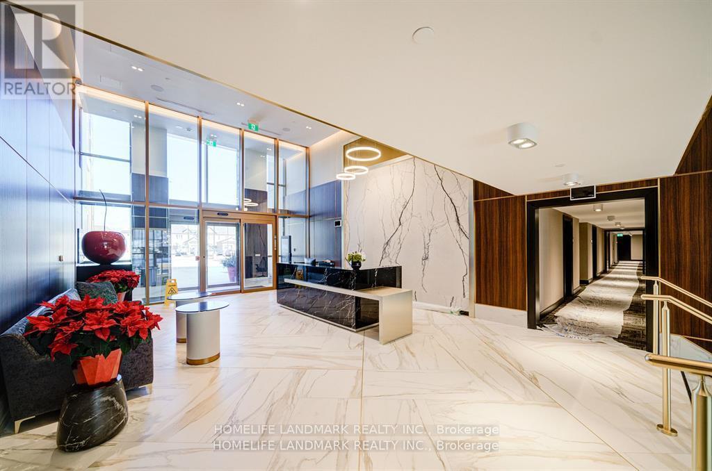 A spacious lobby with a reception desk and a staircase.