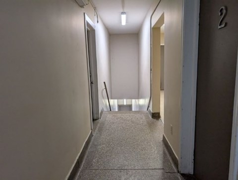 A hallway with a number 2 on the wall.