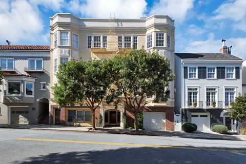 A large two-story building with a balcony on the second floor.