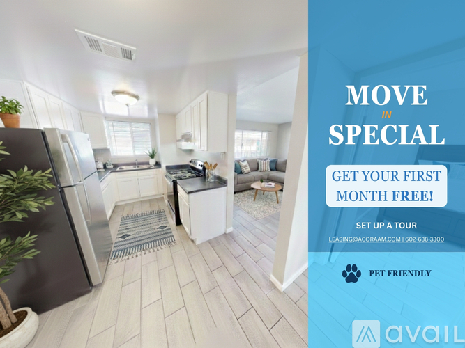 A kitchen with a refrigerator, a stove, and a dining table is on display for a move-in special.