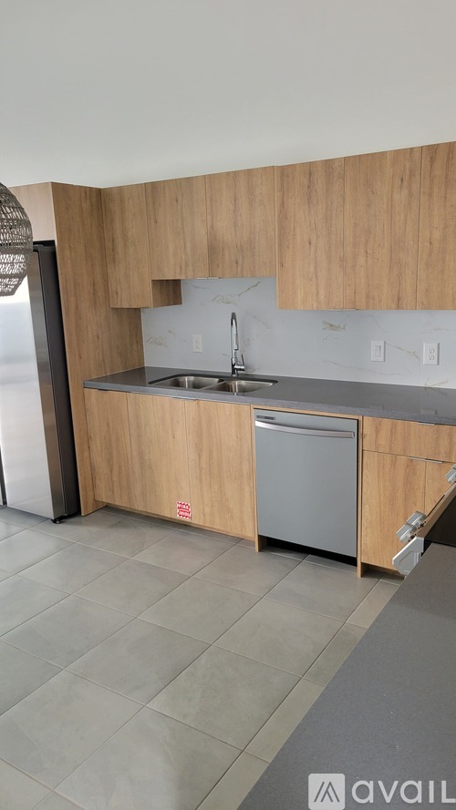 A kitchen with a sink and a dishwasher.