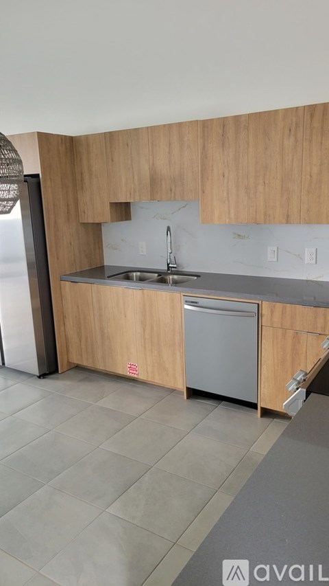 A kitchen with a sink and a dishwasher.