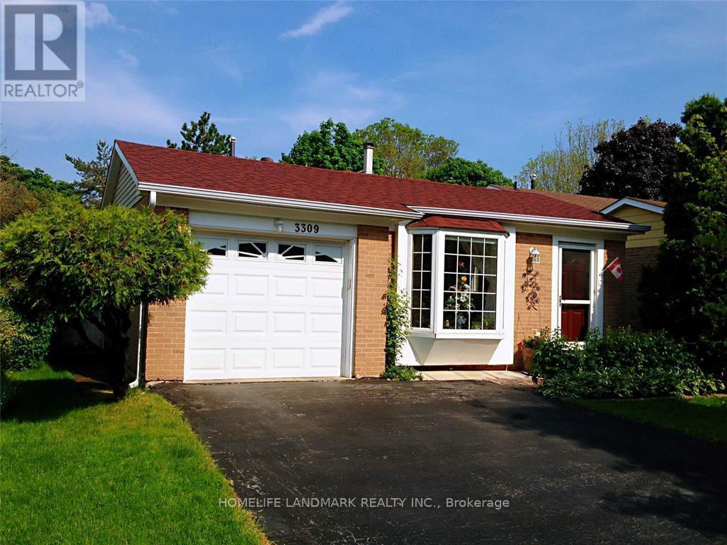 A house with a white garage door is for sale.