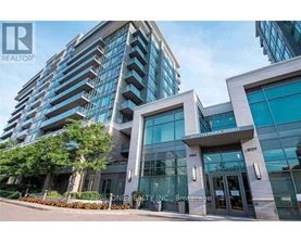 A modern building with a glass facade and a sign that reads "REALTOR".