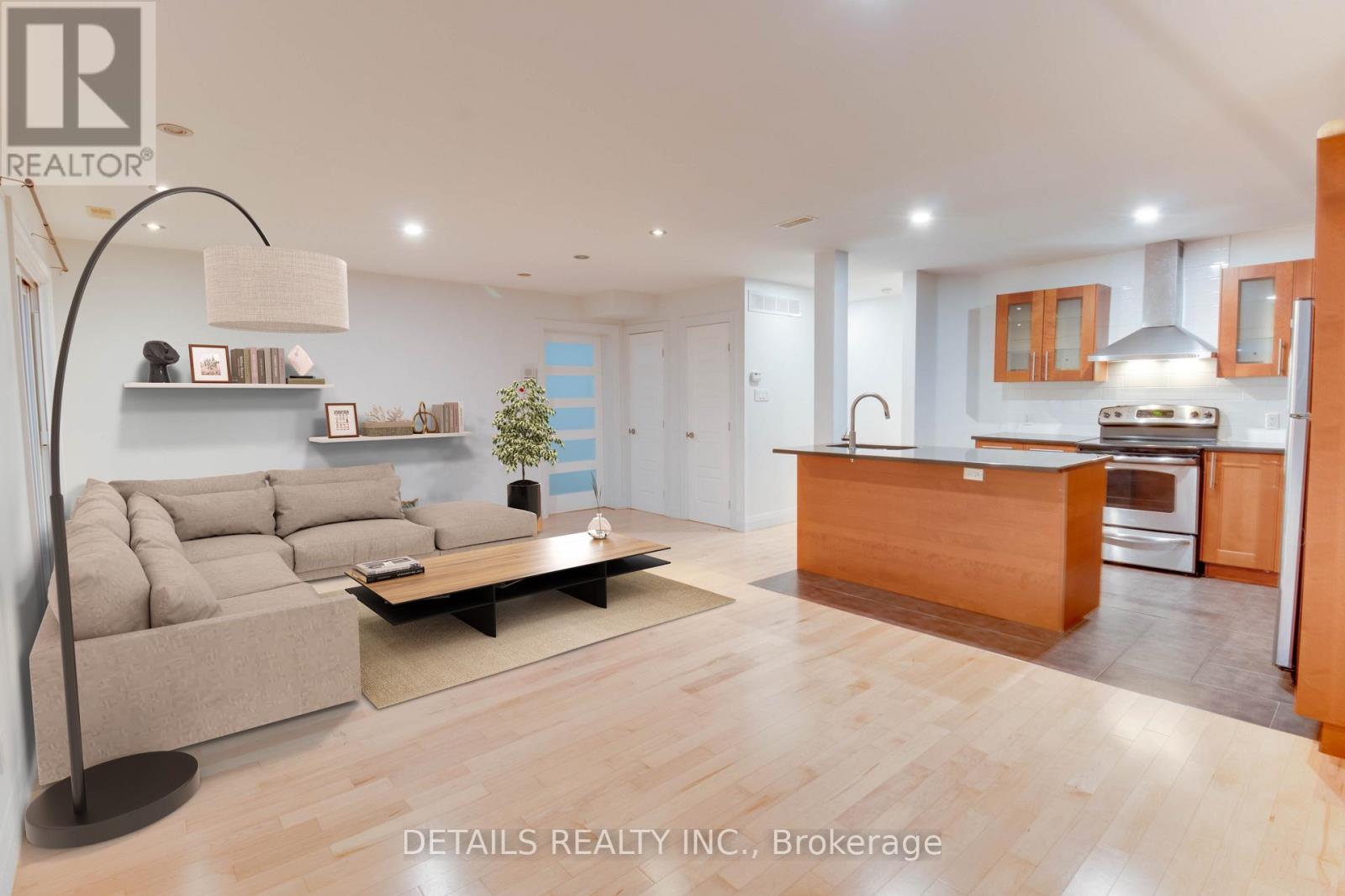 A modern living room with a grey sofa and a wooden coffee table.