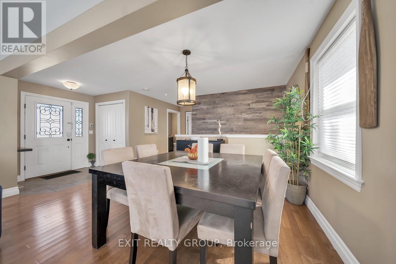 A dining room with a table set for four.