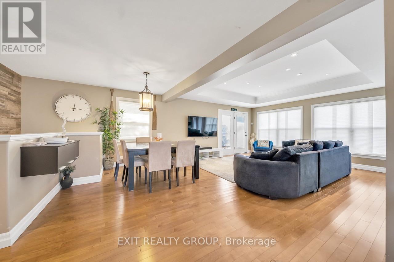 A well-lit living room with a dining table and a couch.