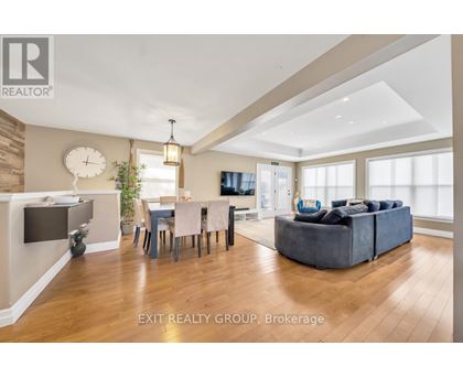 A well-lit living room with a dining table and a couch.