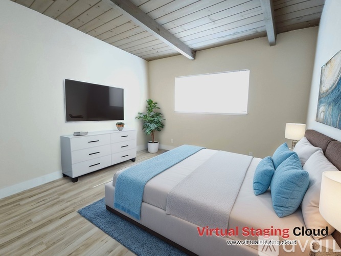 A bedroom with a bed, a dresser, a plant, and a painting on the wall.