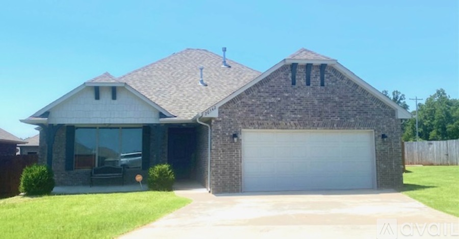A house with a garage and a driveway.