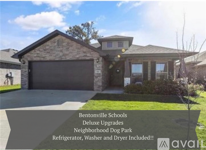 A house with a sign that says "Bentonville Schools Deluxe Upgrades Neighborhood Dog Park Refrigerator, Washer and Dryer Included!".
