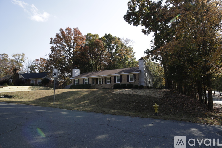 A house with a flag on the front lawn.
