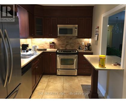 A kitchen with a stove top oven and microwave above it.