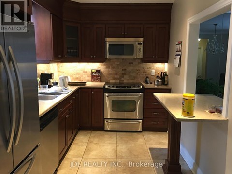 A kitchen with a stove top oven and microwave above it.