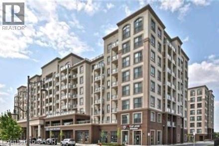 A large, multi-story building with a flat roof and a balcony on the second floor.