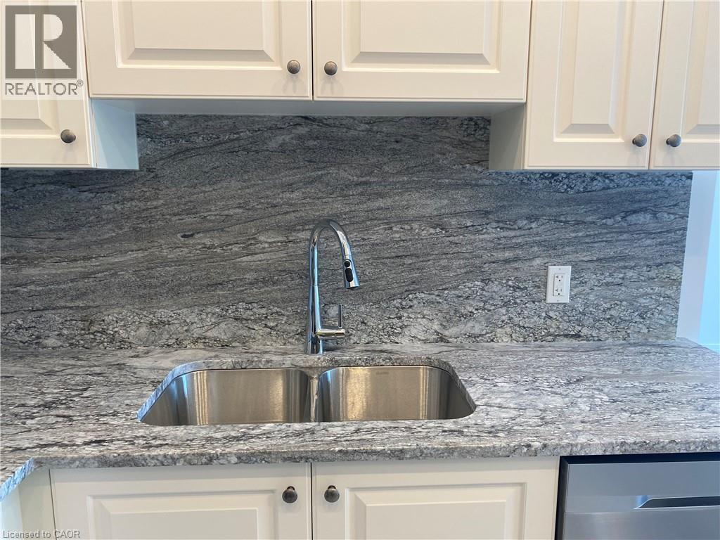 A kitchen with a sink and cabinets.