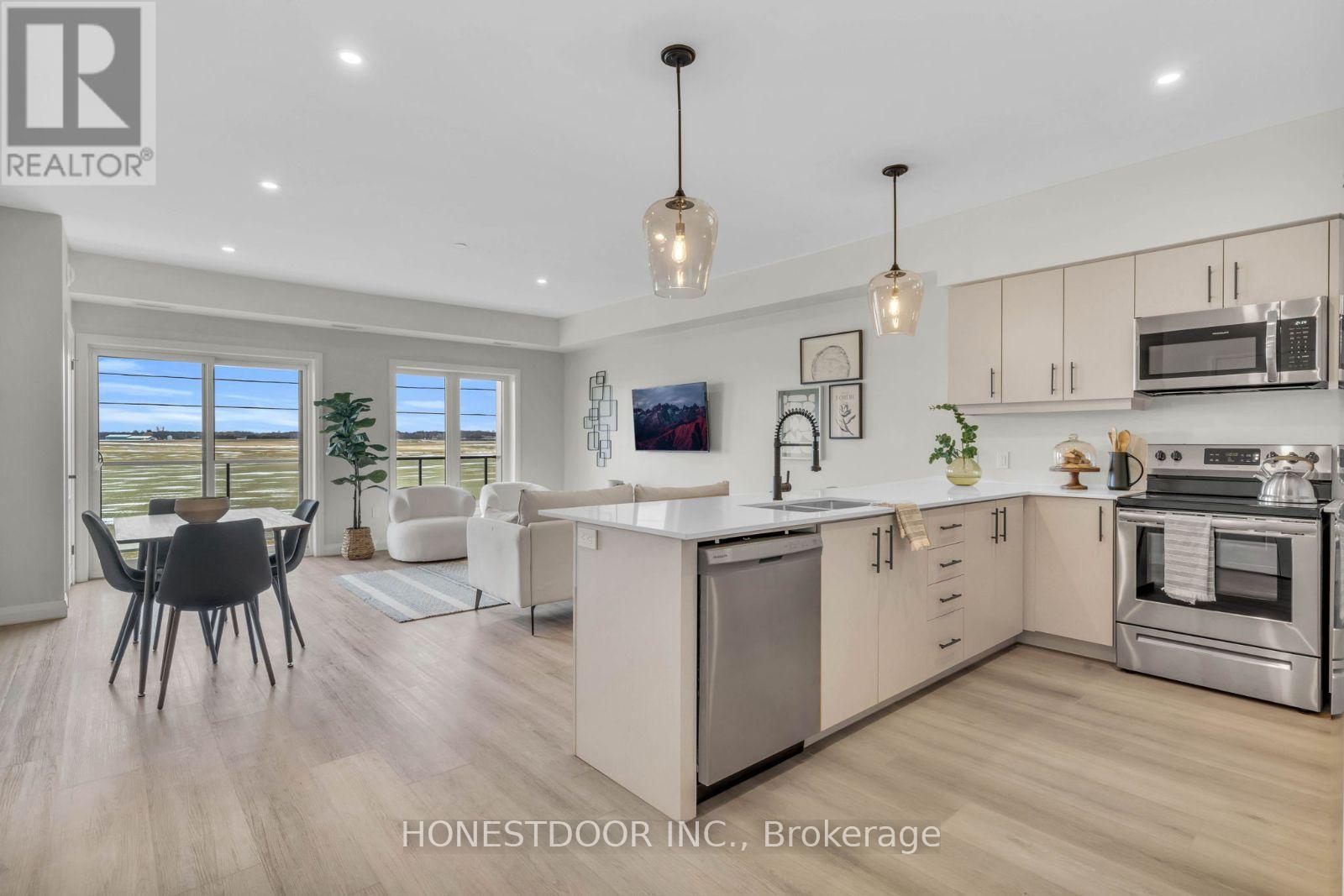 A modern kitchen with a dining table and chairs.