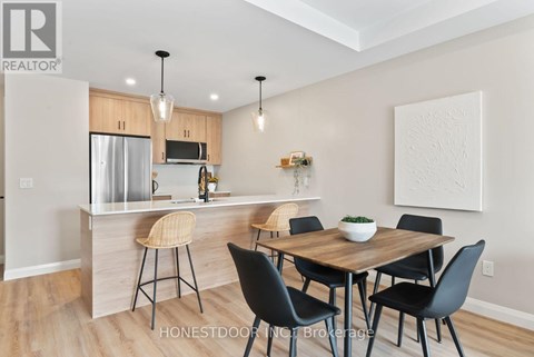 A modern kitchen with a dining table set up.