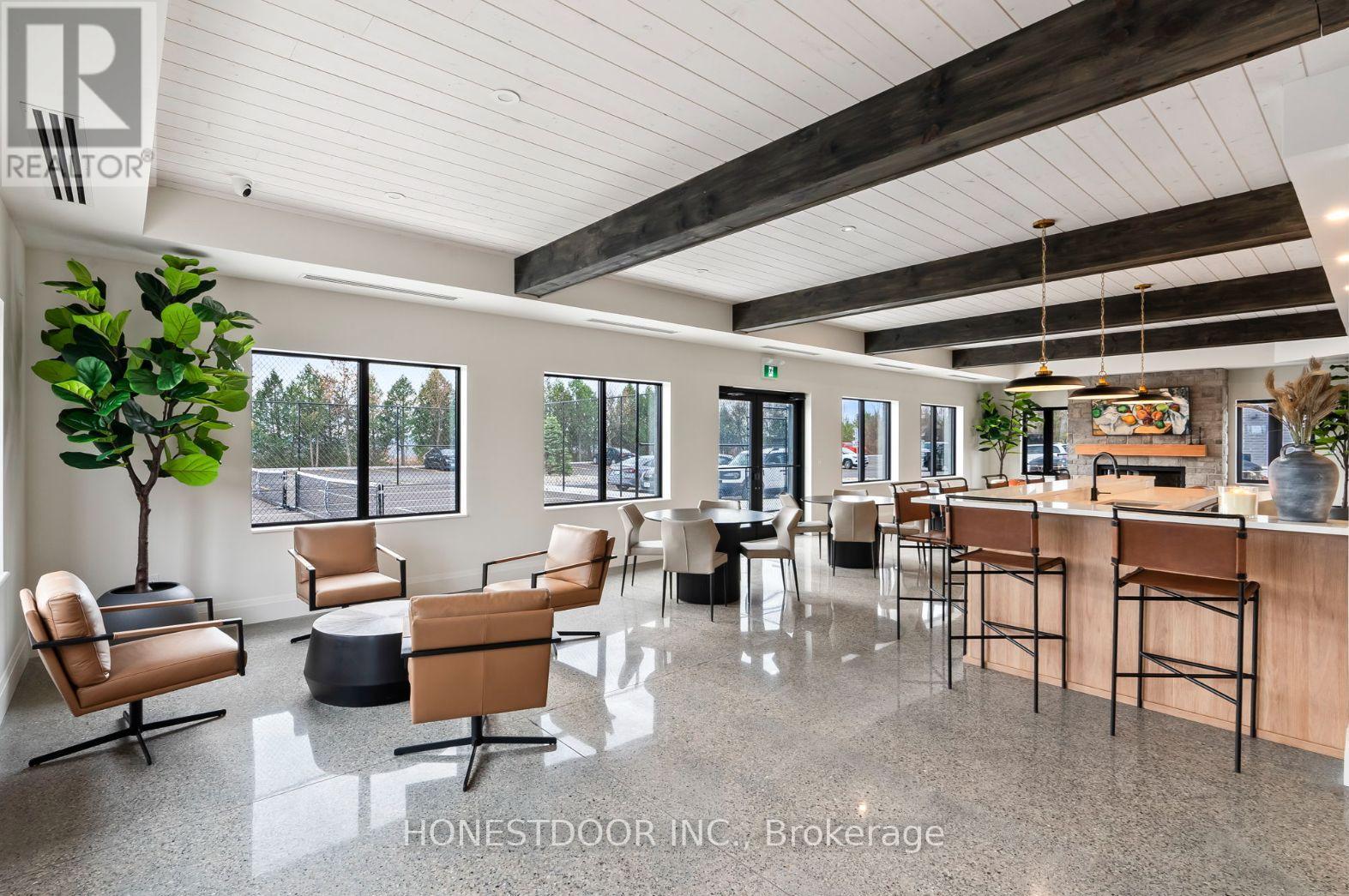 A modern interior space with wooden furniture and a bar area.