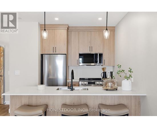 A floor plan of a home with a living room, dining room, kitchen, and two bedrooms.