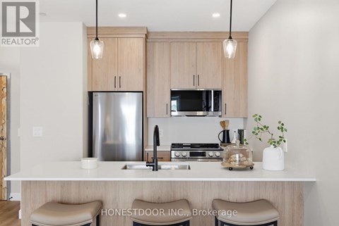 A floor plan of a home with a living room, dining room, kitchen, and two bedrooms.
