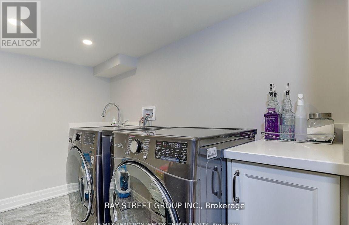 A laundry room with a washer and dryer.