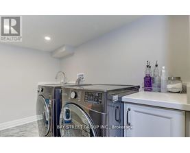 A laundry room with a washer and dryer.