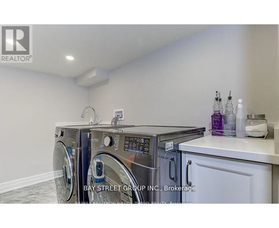A laundry room with a washer and dryer.