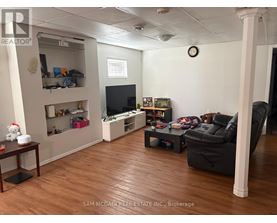 A living room with a TV, a couch, and a coffee table.