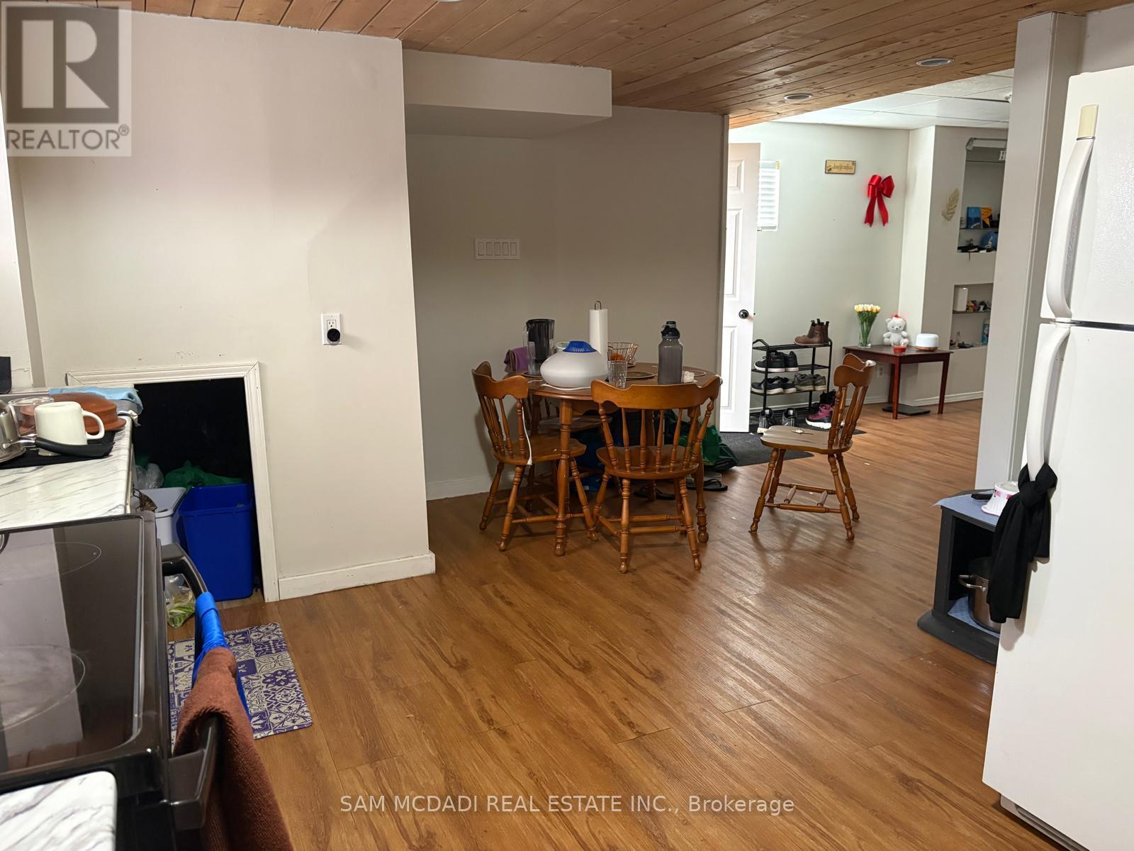 A kitchen with a table and chairs in the middle of the room.