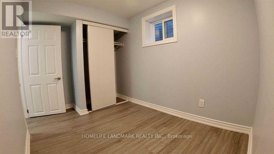 A room with a white door and a window.