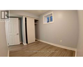 A room with a white door and a window.
