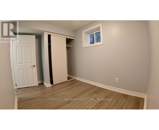 A room with a white door and a window.