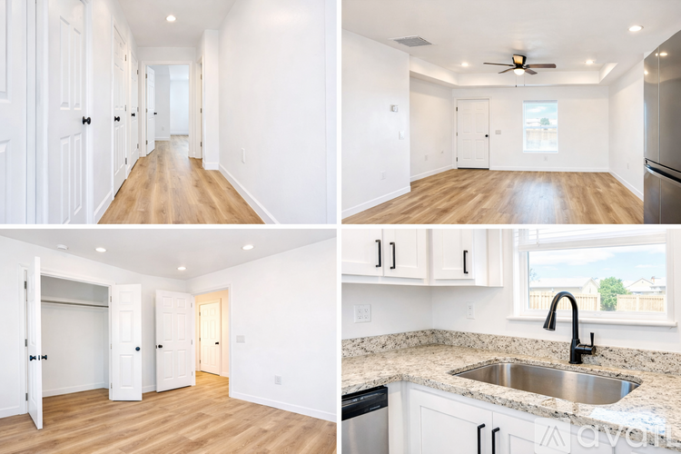 A white interior of a house with a kitchen and a hallway.