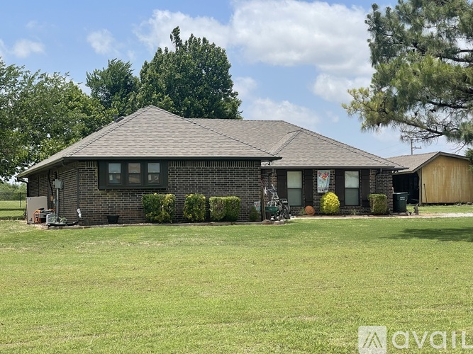 A house with a lawn in front of it.