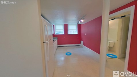 A room with red walls and a white door.