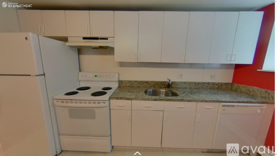 A kitchen with white appliances and cabinets.