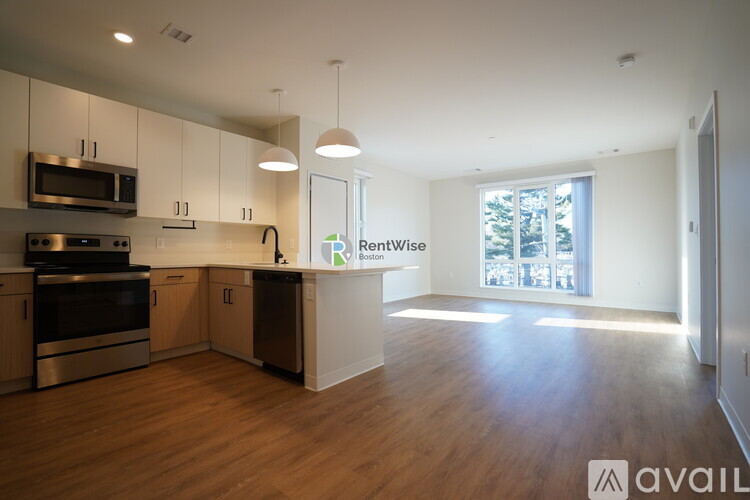 A kitchen with a stove top oven and microwave.