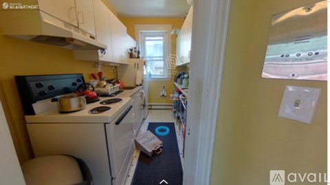 A small kitchen with a stove and a microwave.
