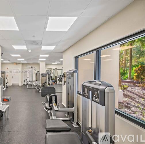 A gym with treadmills, weights, and exercise machines.