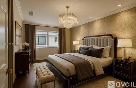 A well-lit bedroom with a large bed and a chandelier.