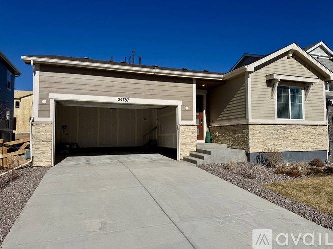 A house with the number 24787 on the garage door.