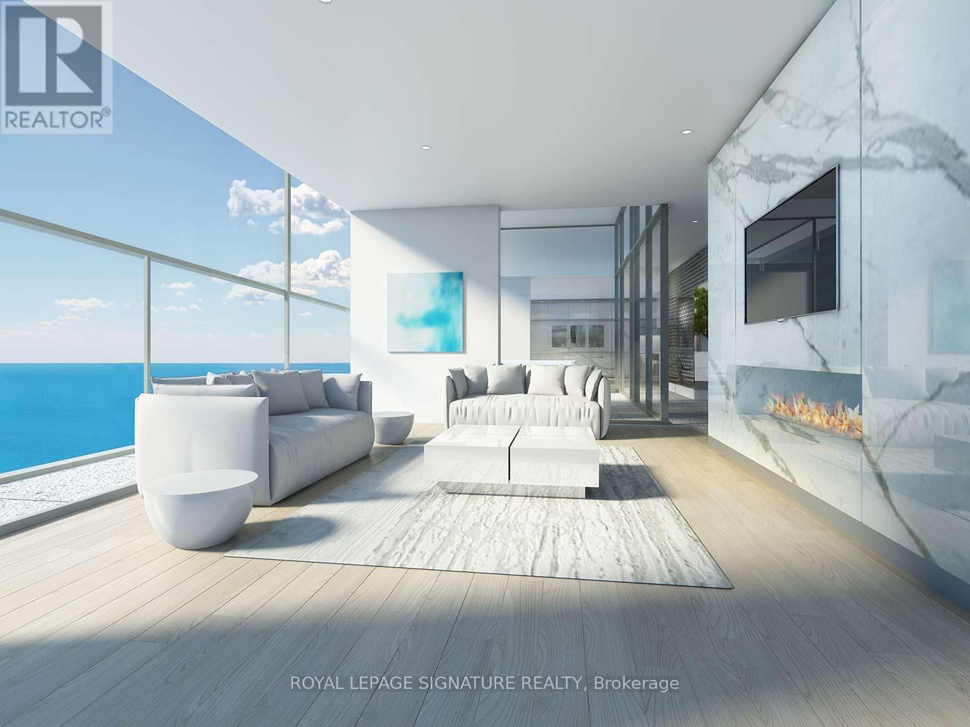 A modern living room with a view of the ocean.
