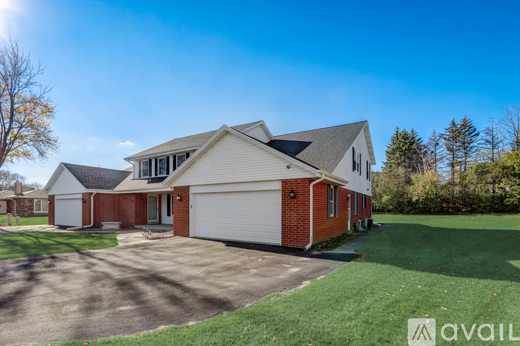A house with a garage is available for sale.