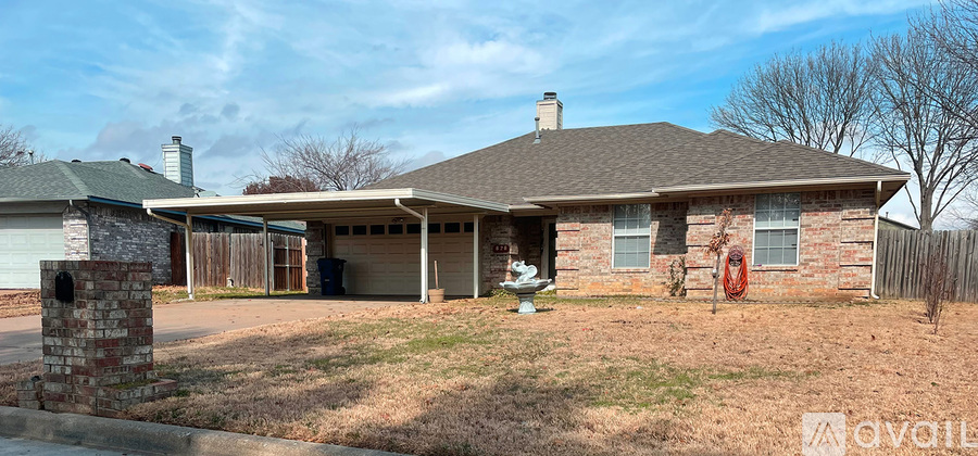 A house with a garage is for sale.