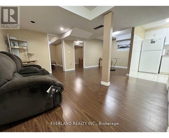 A living room with a couch and a chair in it.